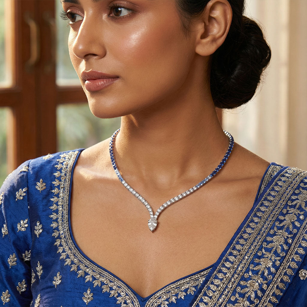 blue sapphire and diamond necklace for women, styled with a traditional blue ethnic outfit
