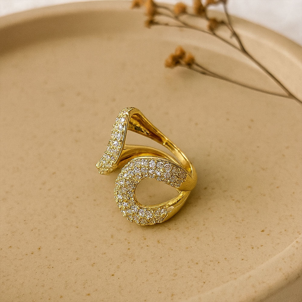 Party wear rings for women in gold finish with bold crystal statement and band design