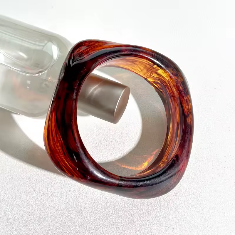 Brown party wear bangles for women in stacked resin design