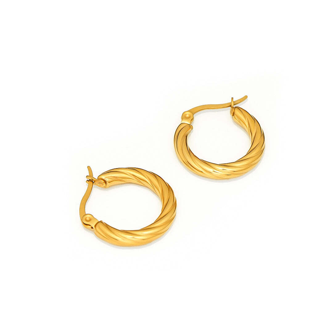 Pair of gold hoop earrings on a white background