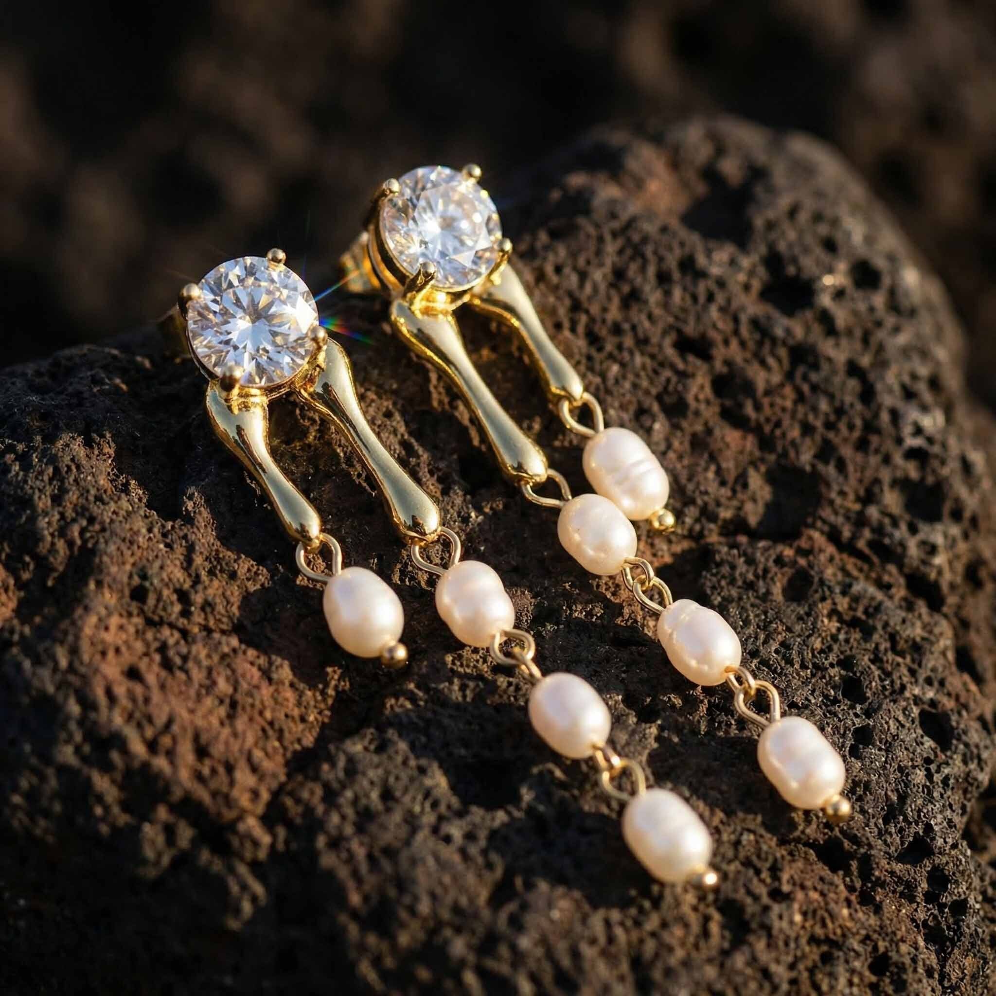Gold dangle earrings for women with white pearls and round crystal top