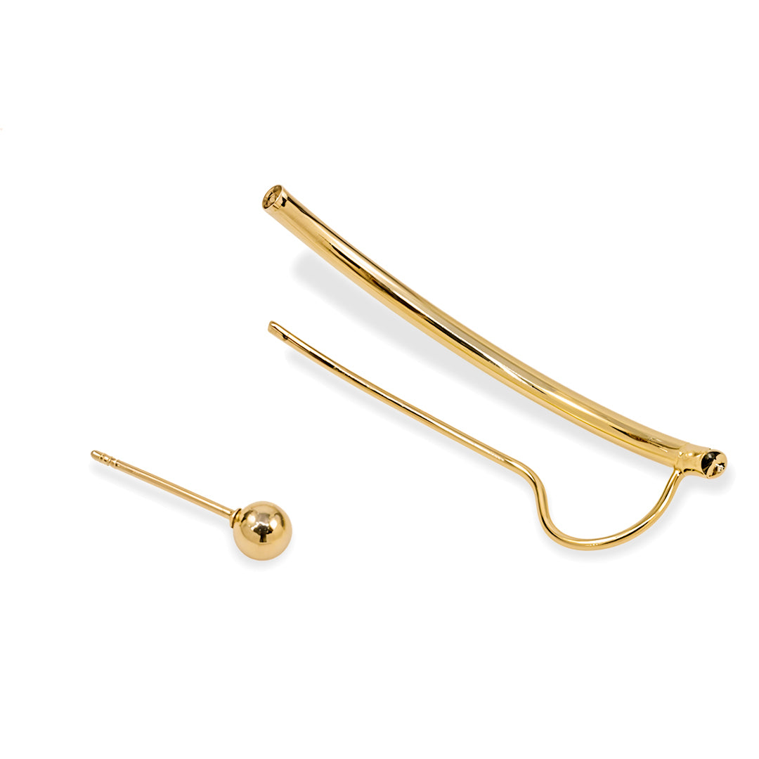 Gold earrings for women components on a white background