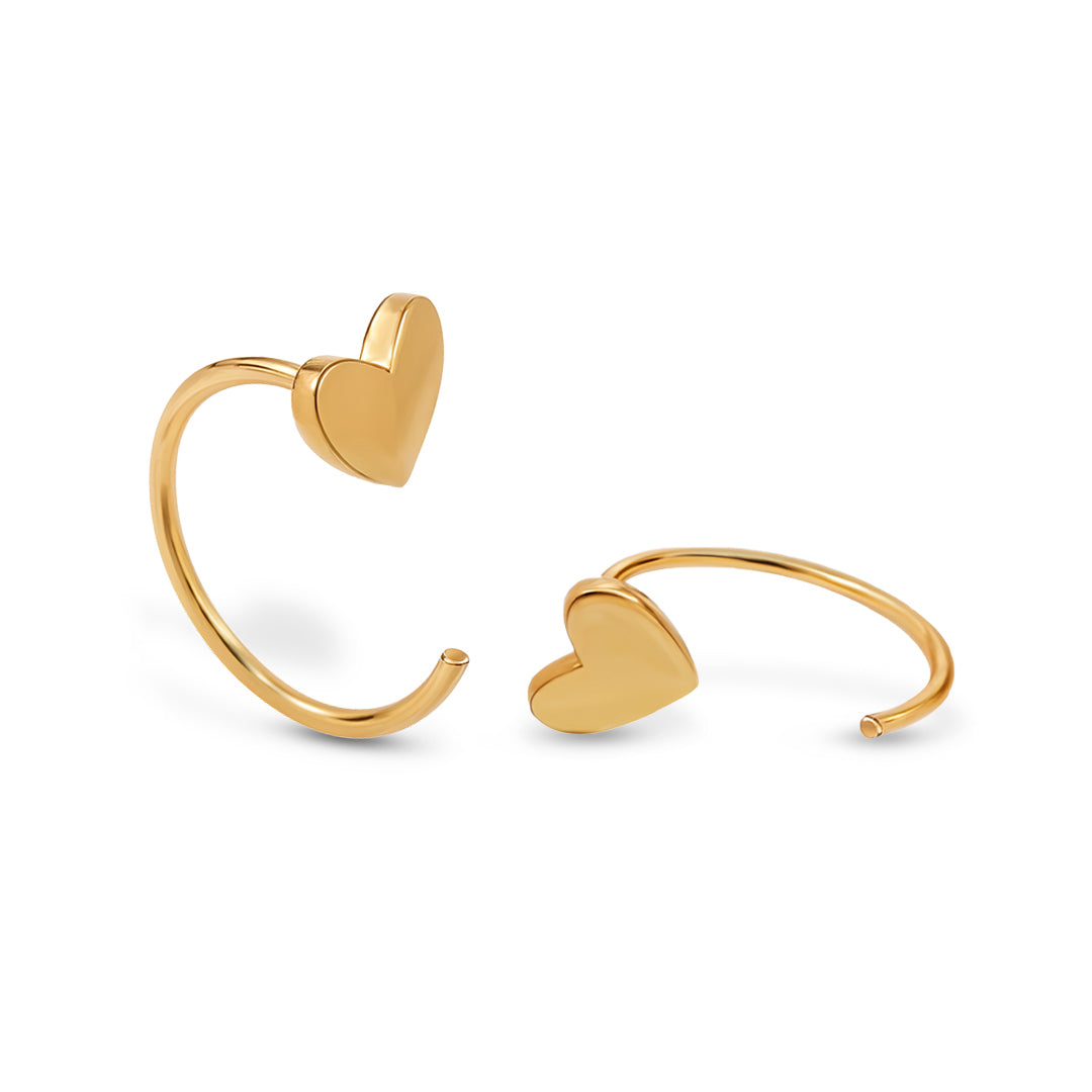 Gold heart-shaped earrings for women on a white background