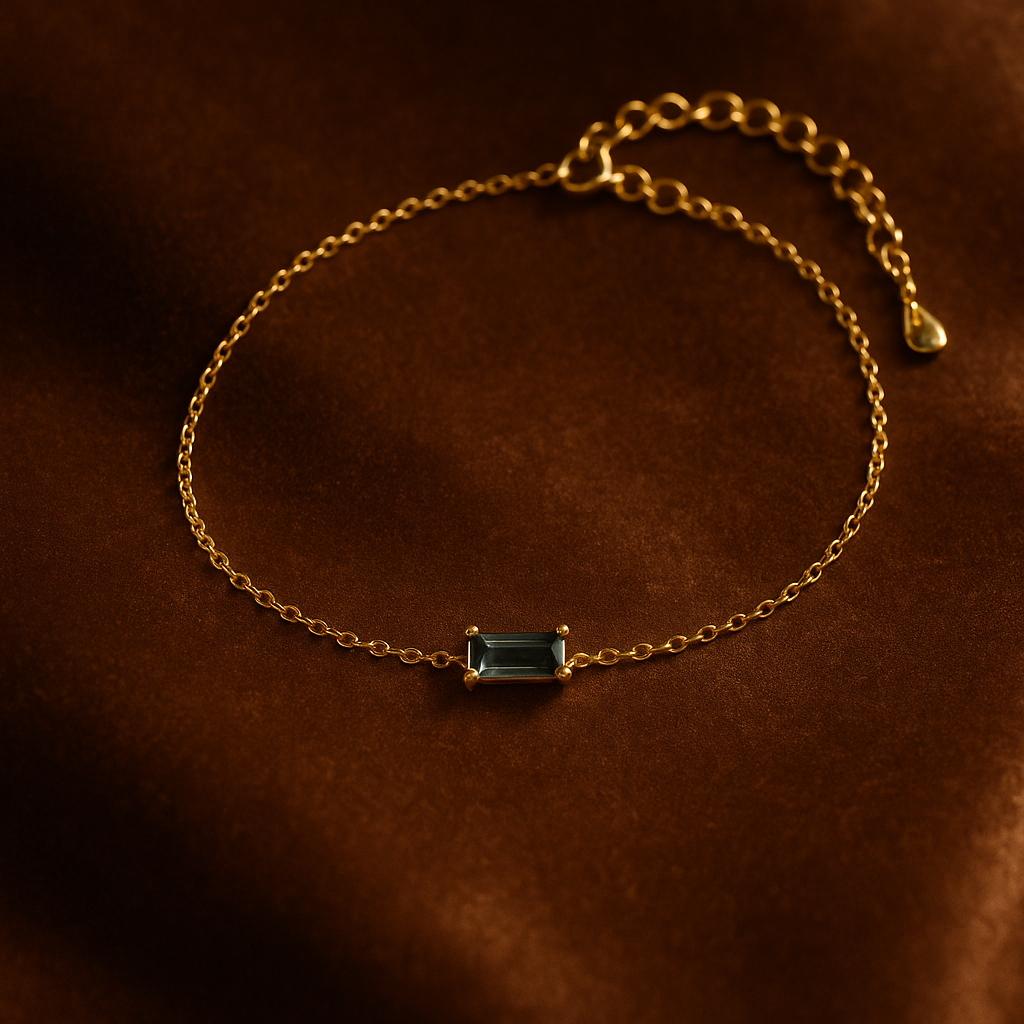 Gold bracelet with a blue gemstone