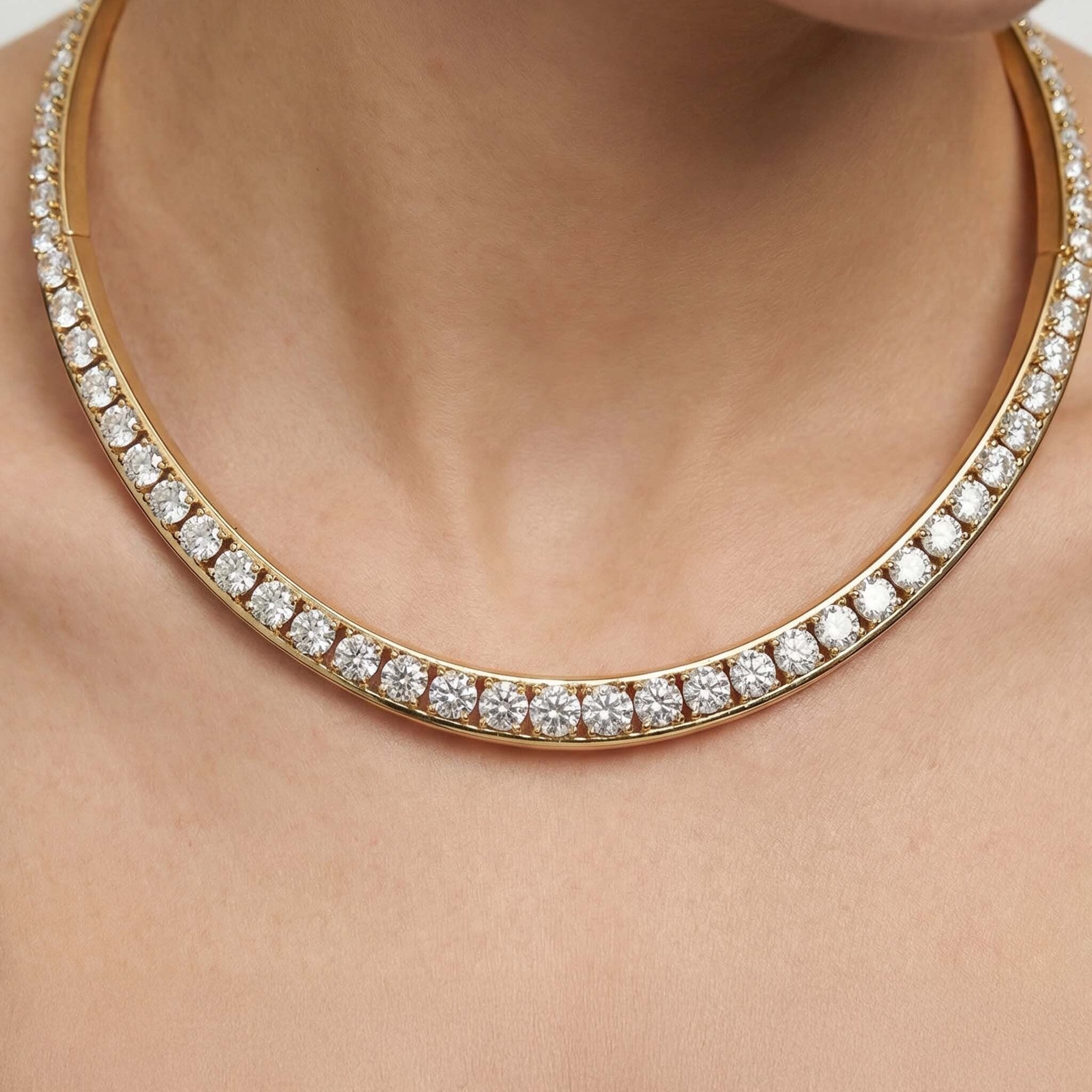 Gold necklace with diamonds on a person's neck