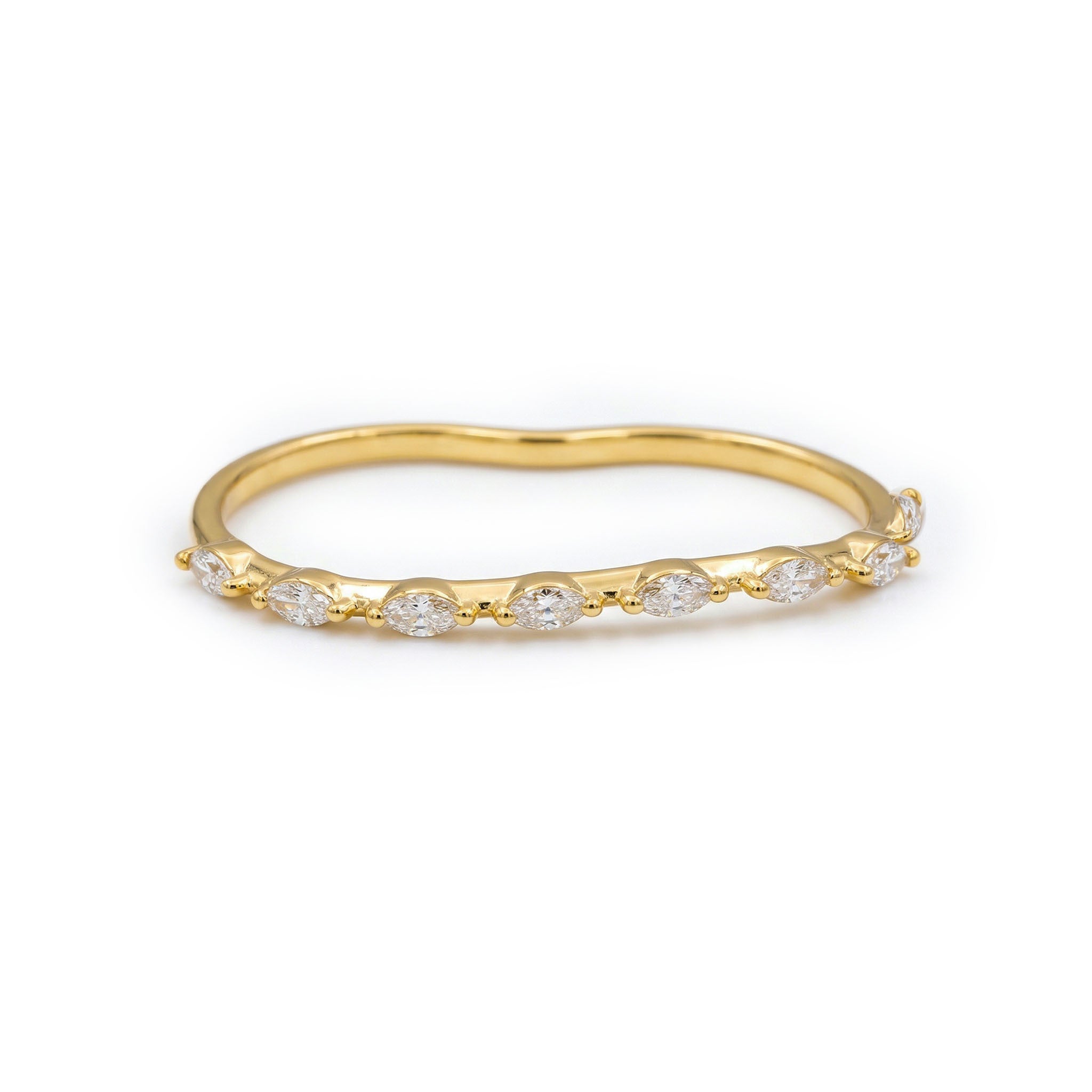 Gold ring with embedded diamonds on a white background