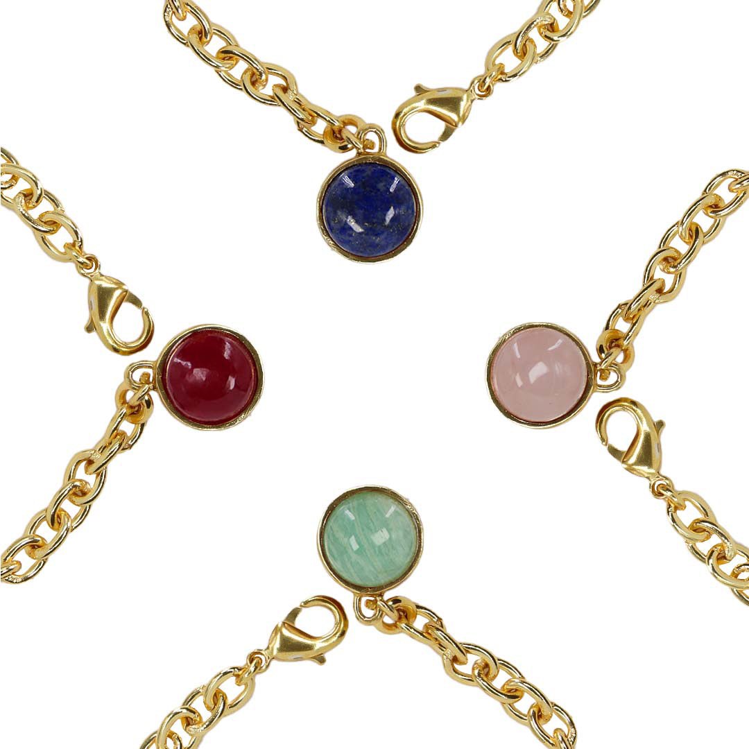 Gold chain bracelets with colorful gemstones on a white background
