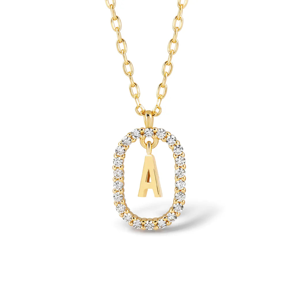 A gold initial pendant necklace featuring the letter 'A' encased in a bezel-set diamond border, suspended from a gold link chain on a white background.