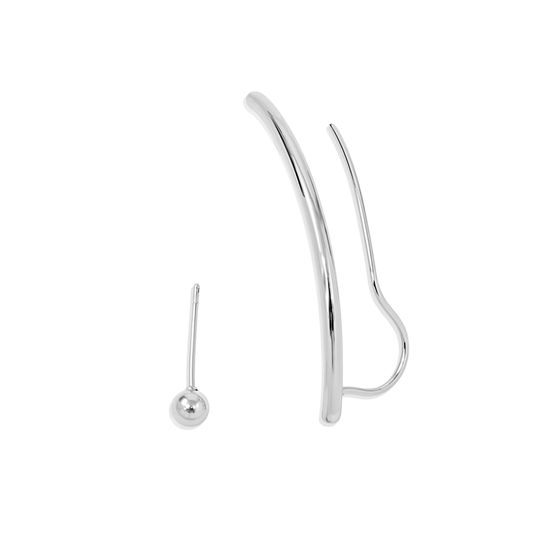 Silver ear cuff and single earring on a white background