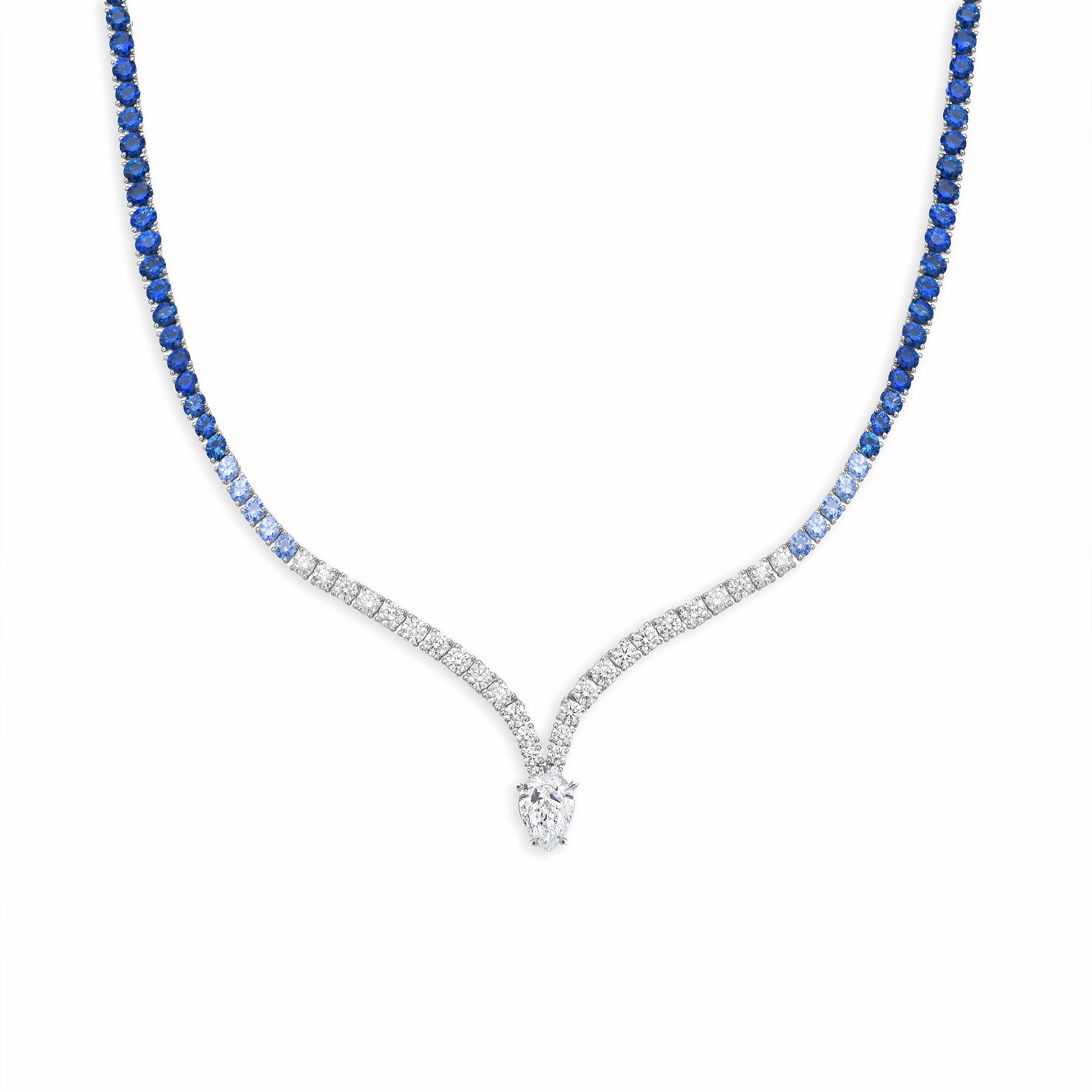 Necklace with blue gemstones and a diamond pendant on a white background