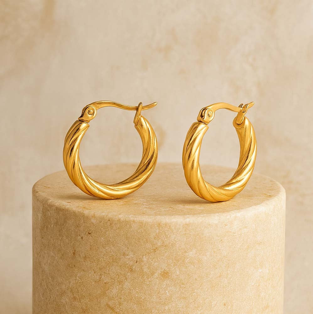 gold twisted hoop earrings for women bold design for party wear women
