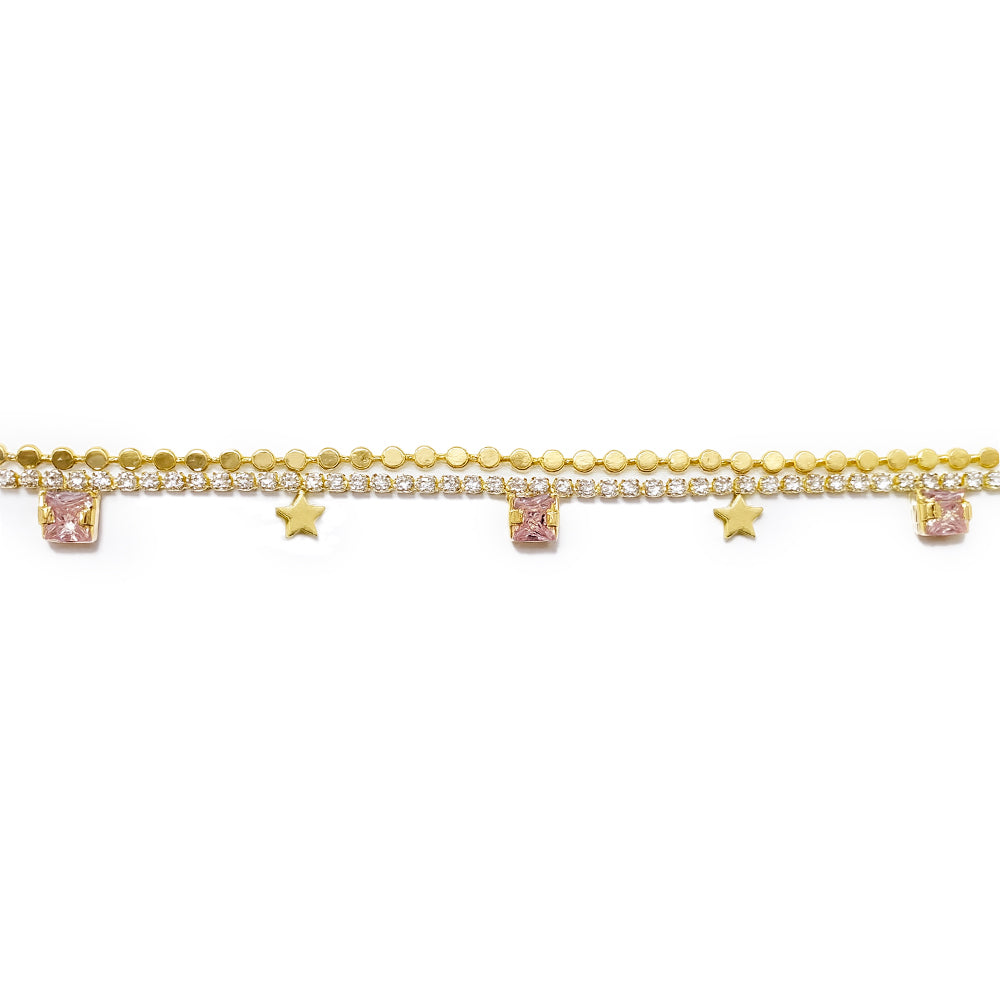 Gold anklet with star-shaped charms on a white background
