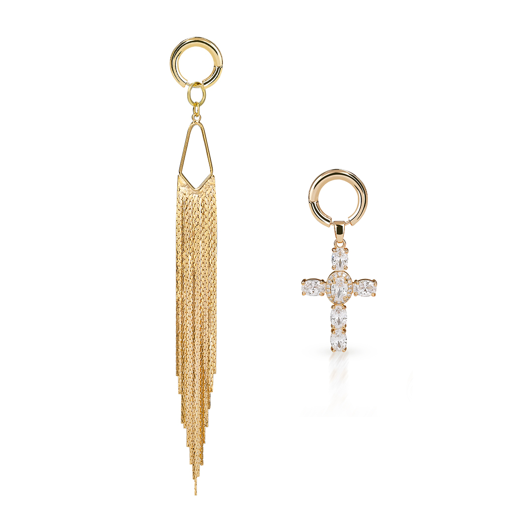 Gold tassel earring and cross earring with gemstones on a white background
