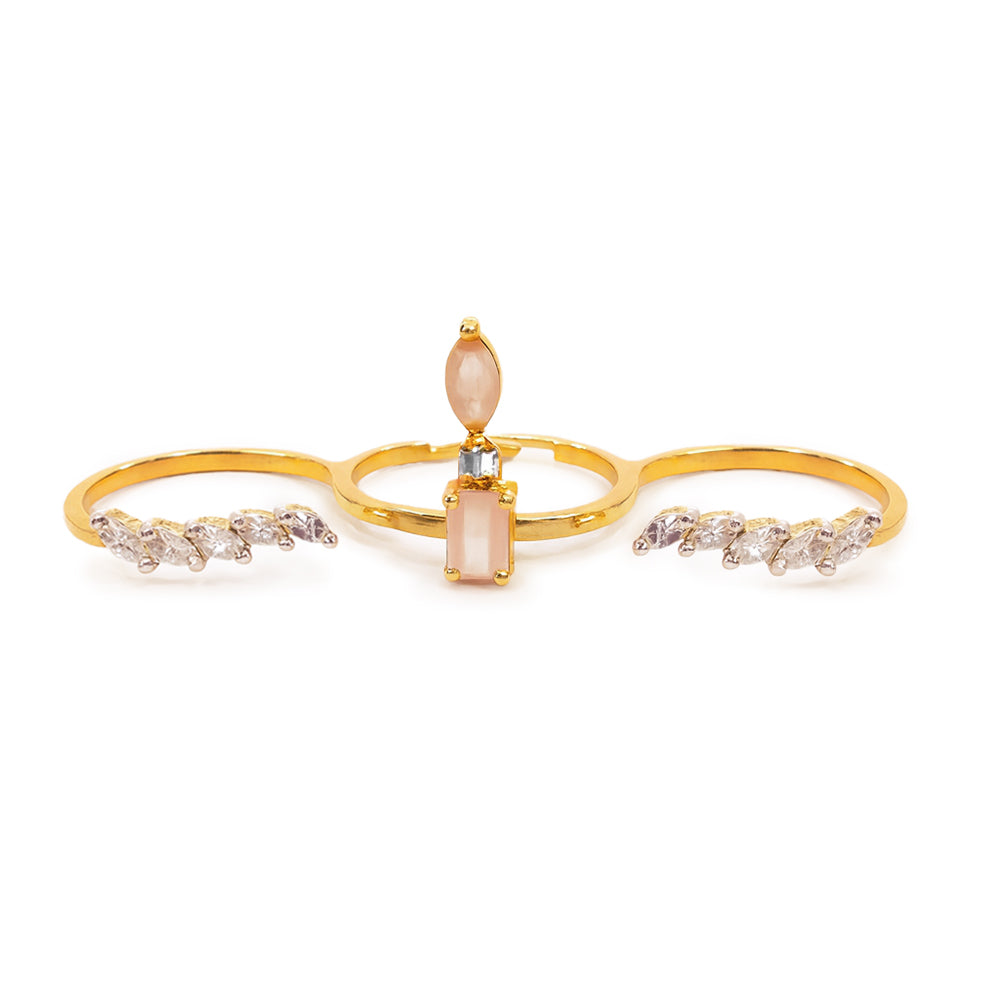 Gold ring with a central pink gemstone and diamond accents on a white background