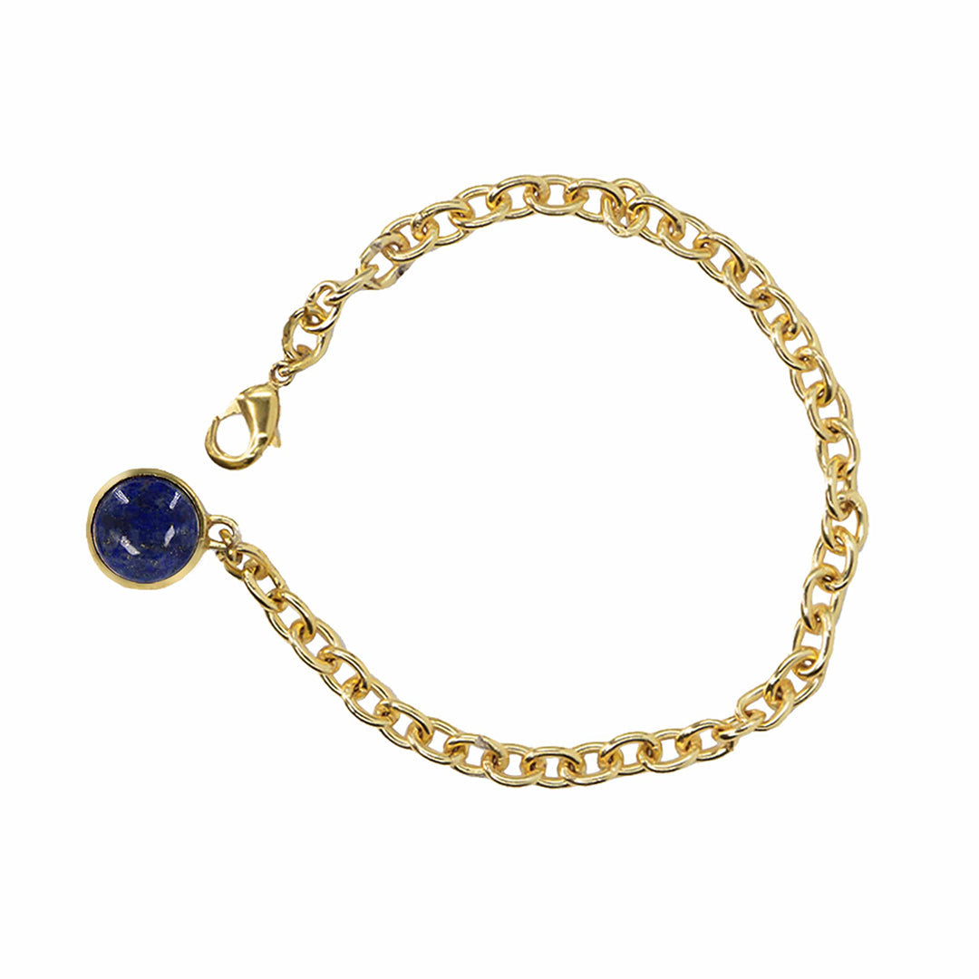 Gold chain bracelet with a blue gemstone on a white background