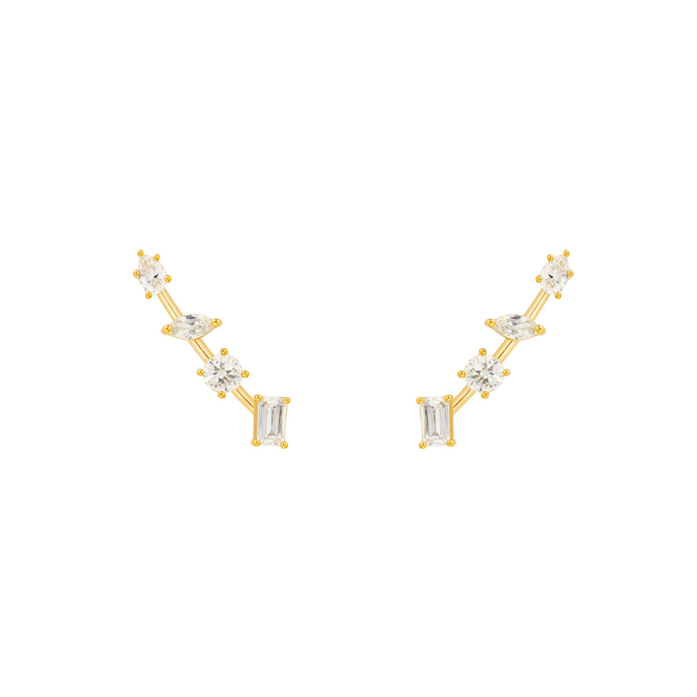 Gold and diamond earrings on a white background