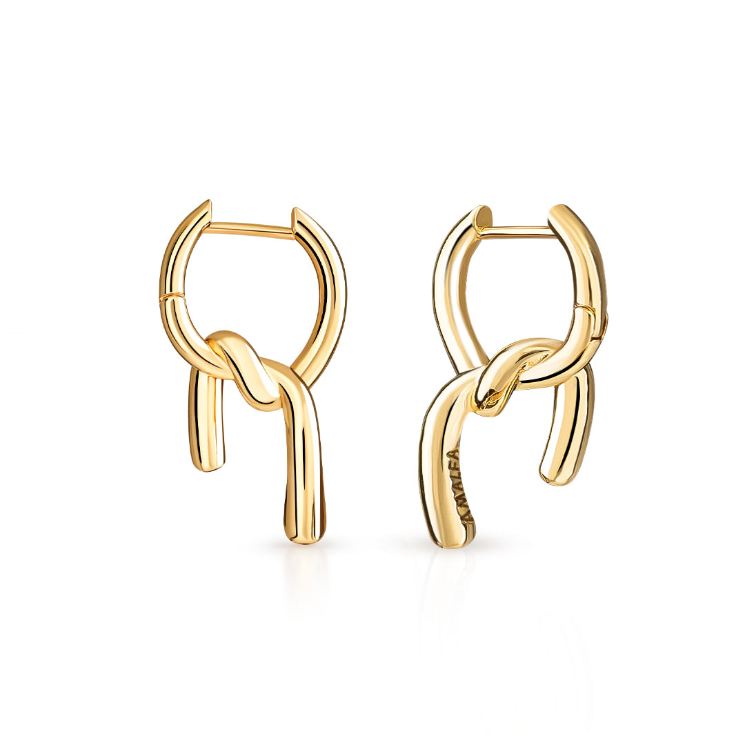 Gold hoop earrings for women on a white background