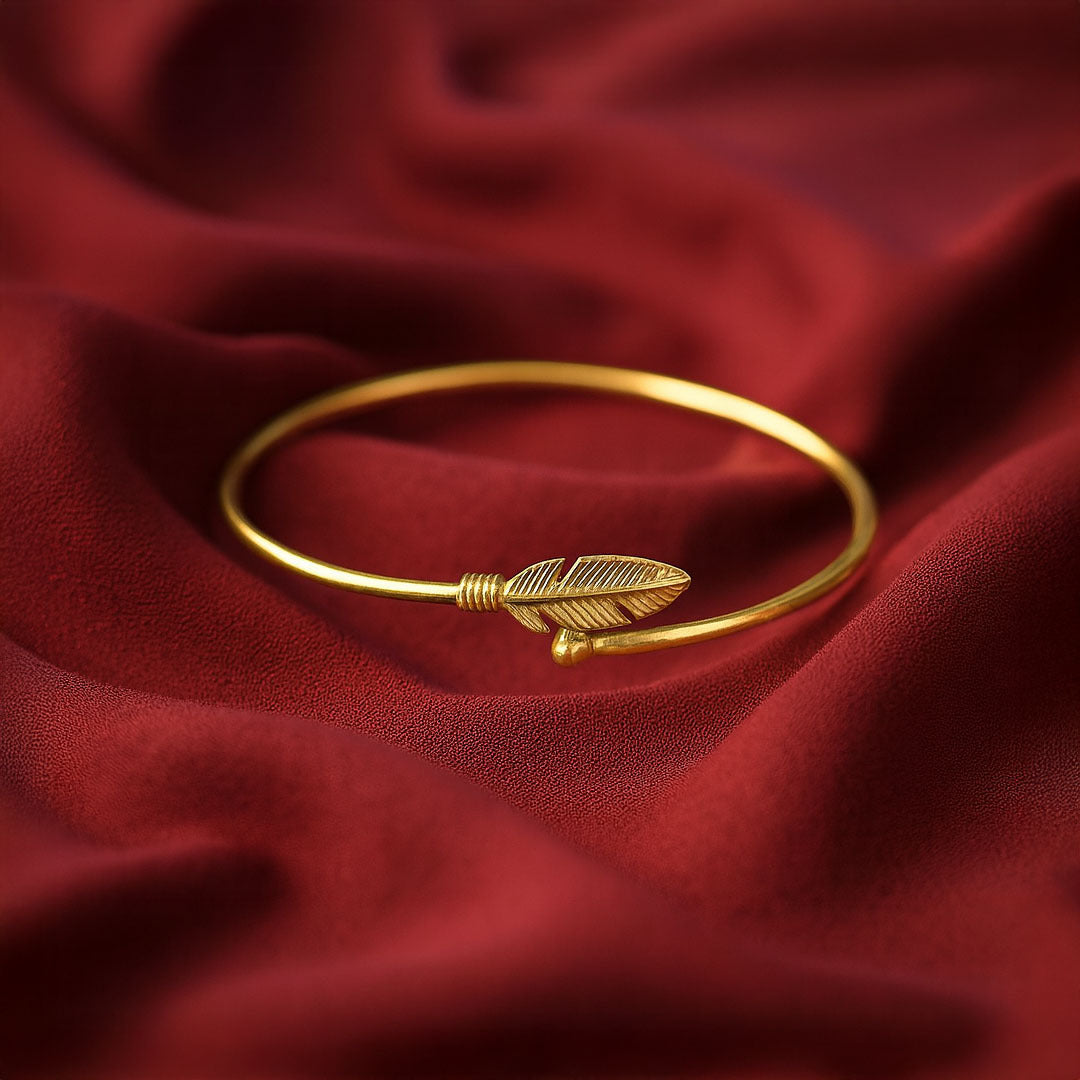 Gold bracelet with feather design