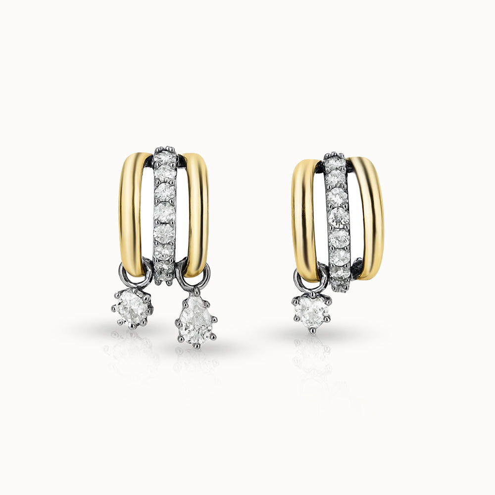 Pair of gold and diamond earrings on a white background