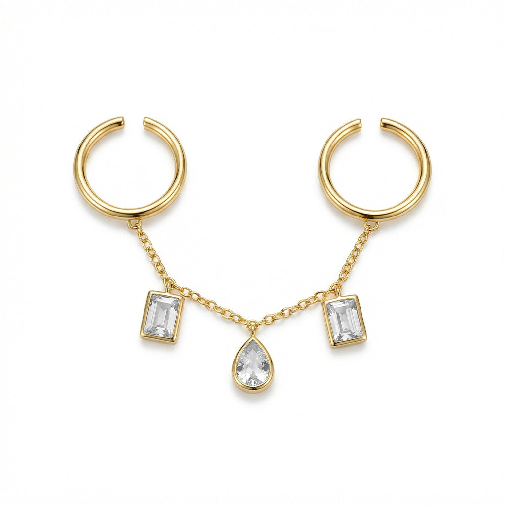Fashion close-up gold multi-ring chain accessory with clear stones.