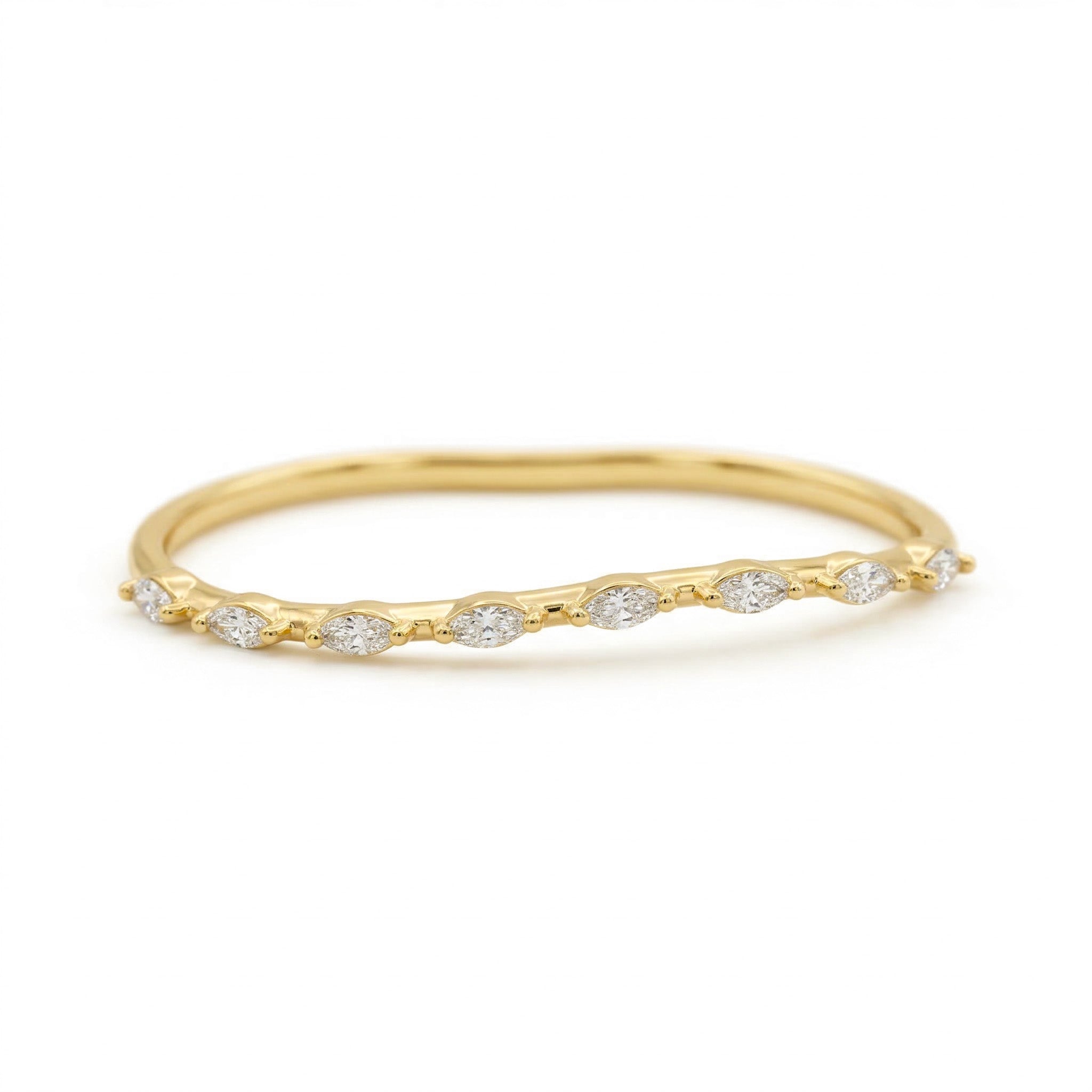 Gold ring with small diamonds on a white background