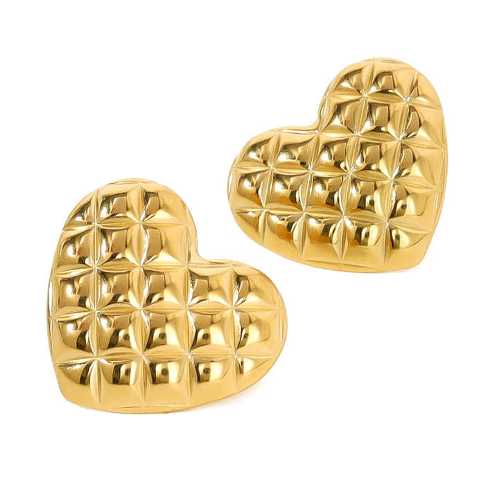 Gold heart-shaped earrings for women with a textured pattern on a white background