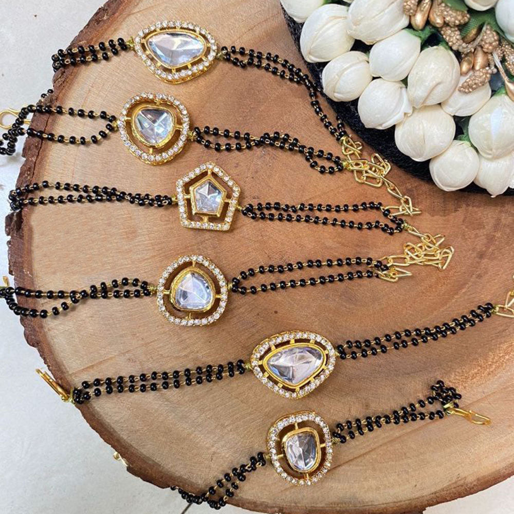 Gold plated Kundan mangalsutra bracelets with black beads and crystal centerpieces in assorted shapes