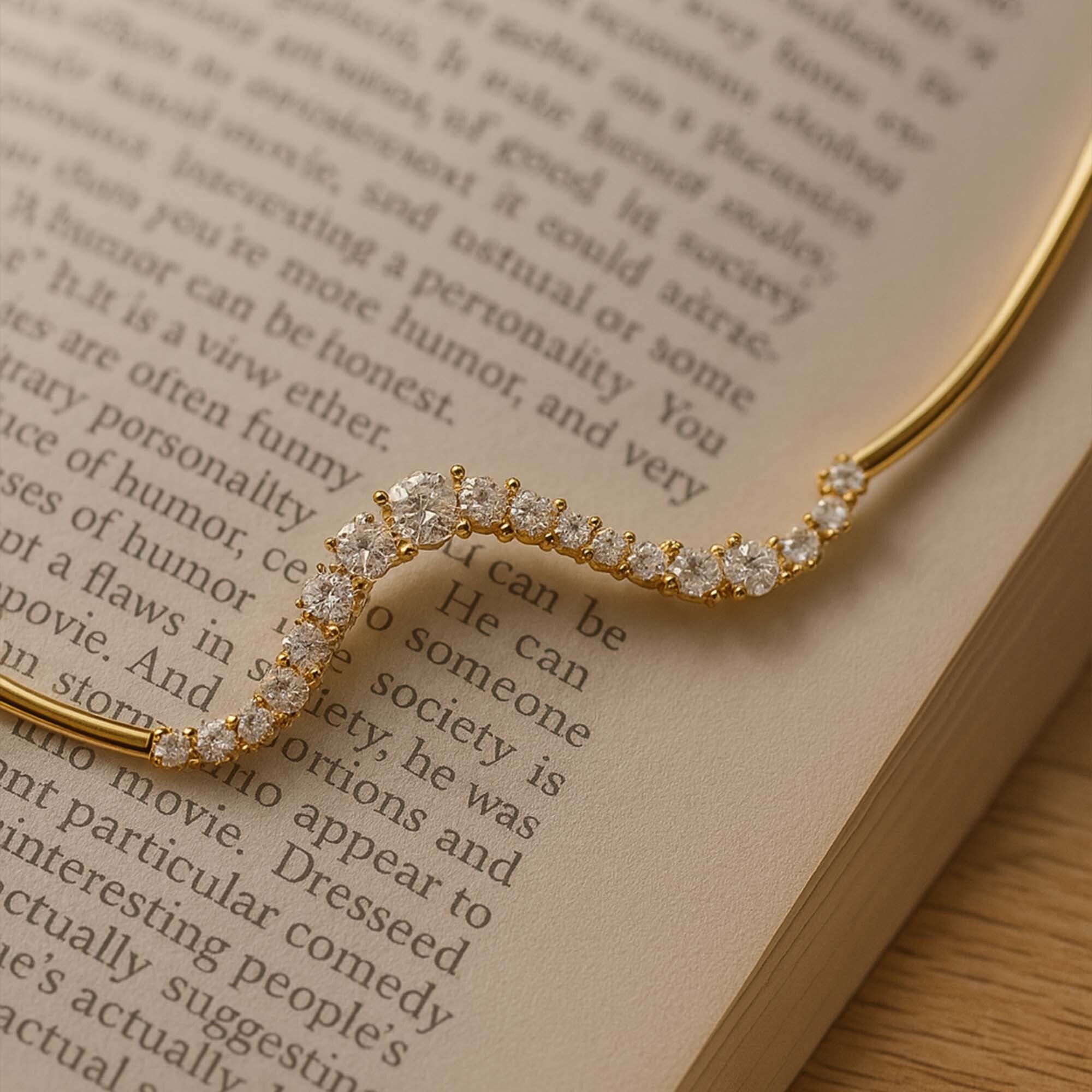 Gold necklace with diamonds on an open book