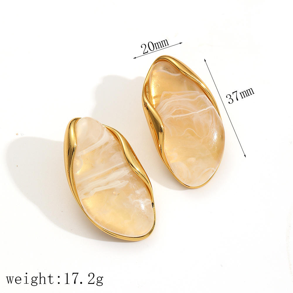 Gold earrings for women with a beige stone design on a white background, showing measurements and weight.