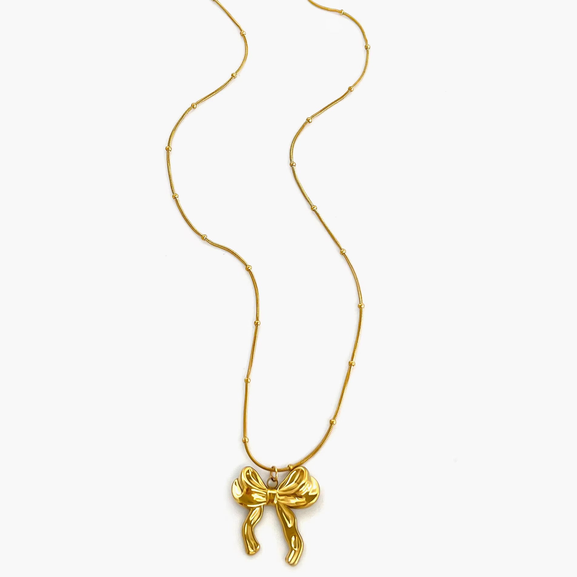 Gold necklace with a bow pendant 