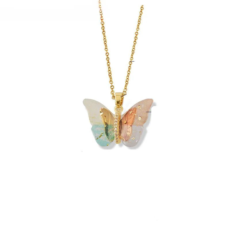 Butterfly-shaped pendant on a gold chaind