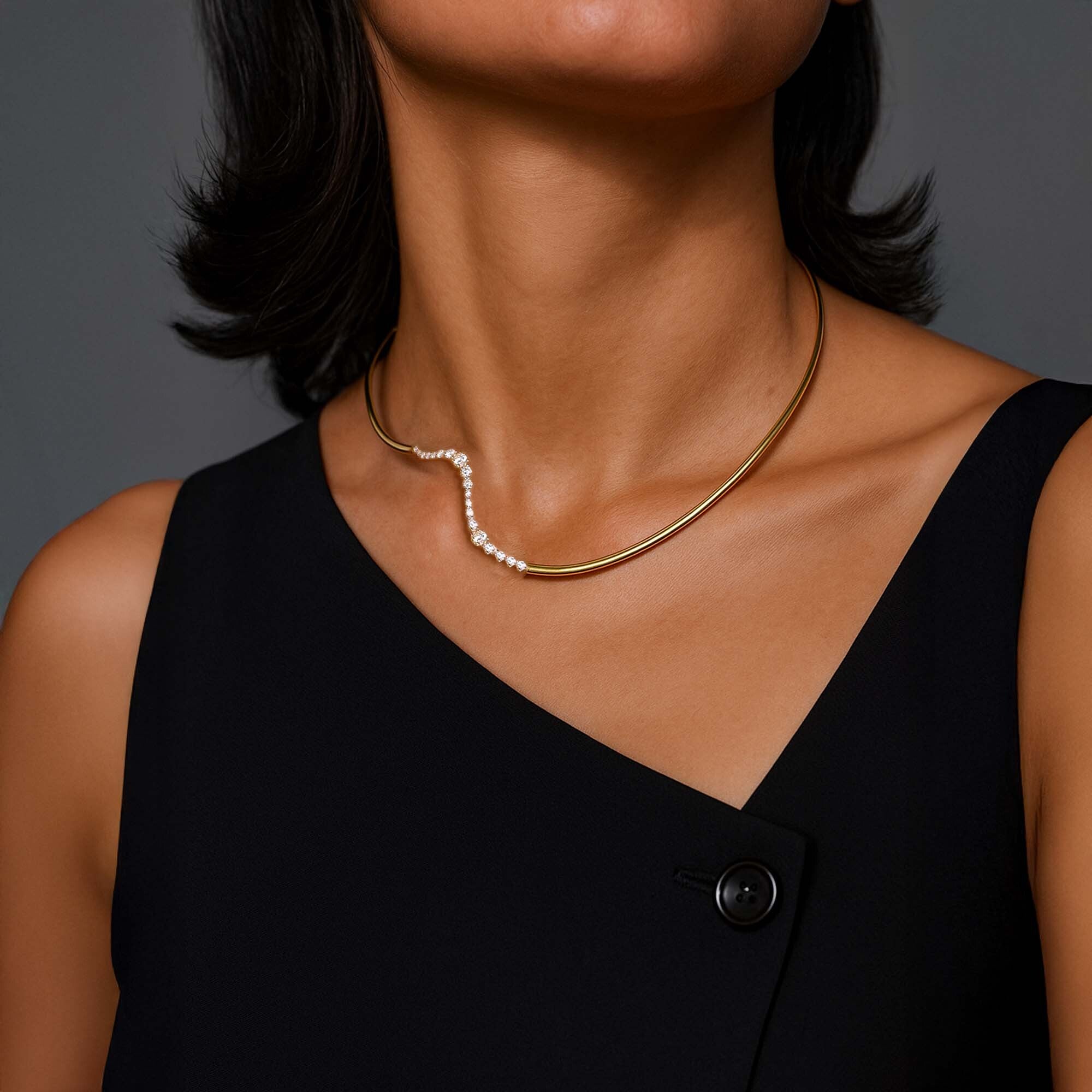 woman wearing a gold plated curved choker necklace with pearl accents