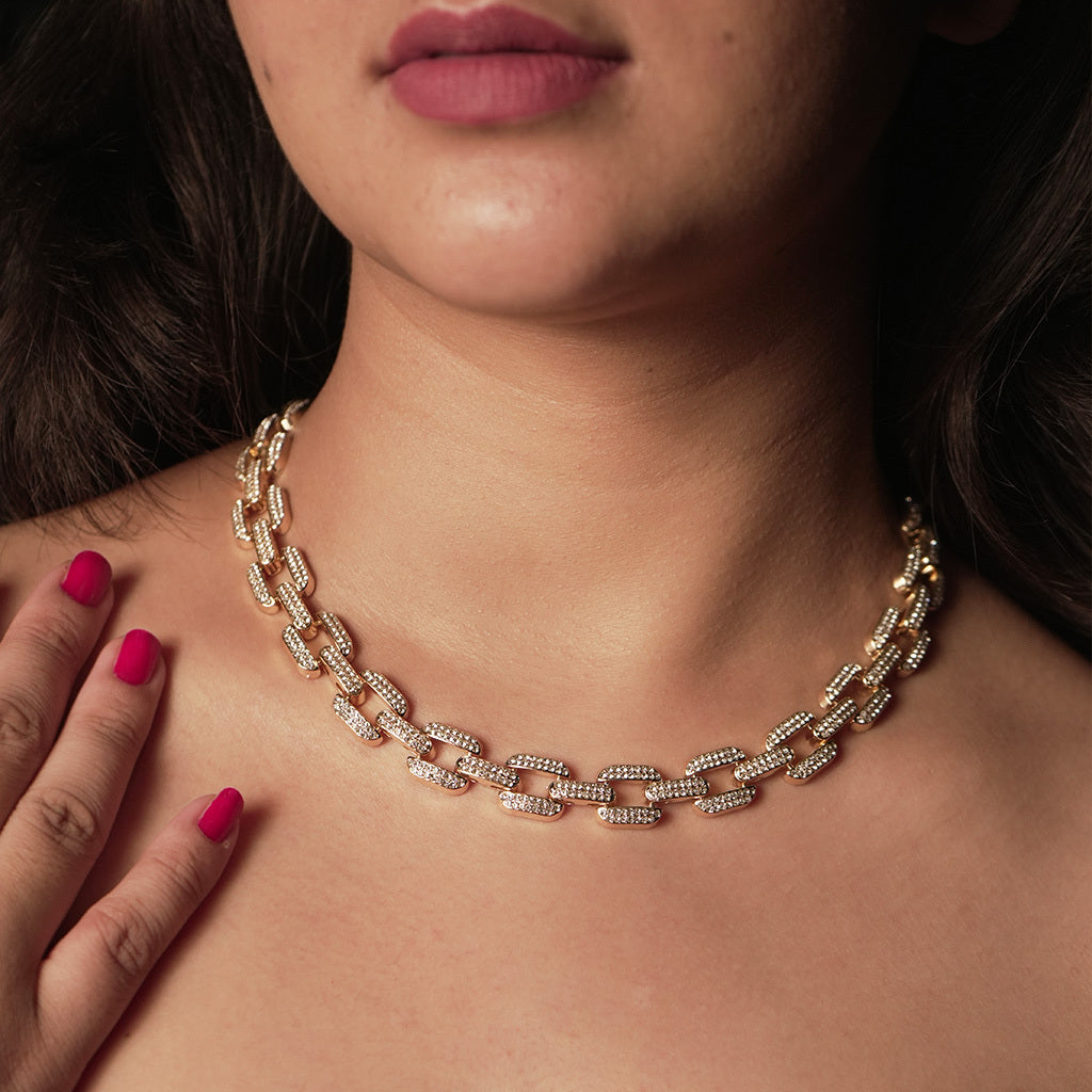 Gold chain necklace  for women with diamonds on a person's neck