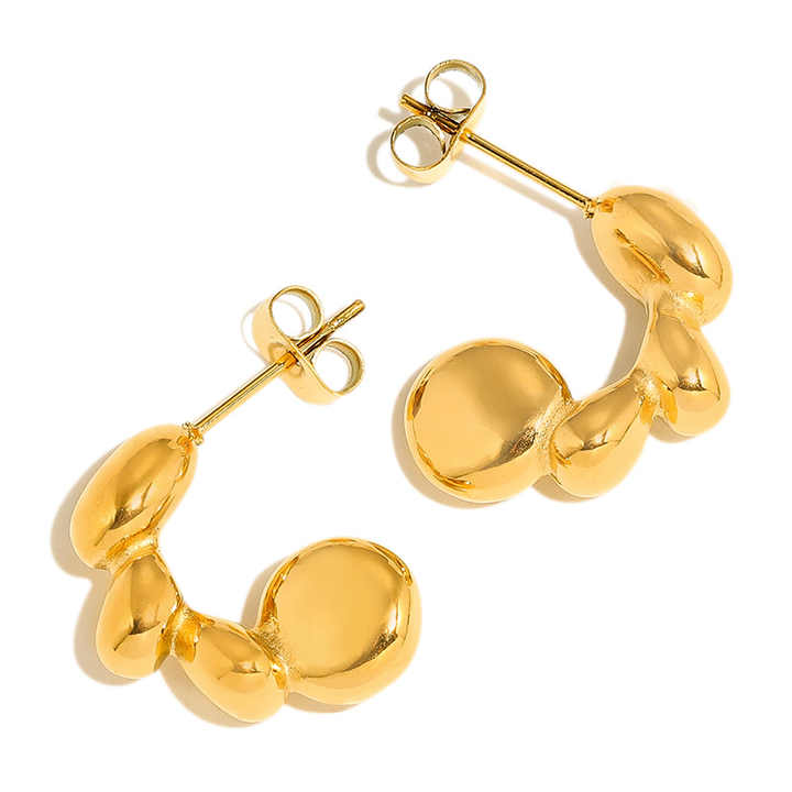 Gold hoop earrings on a white background