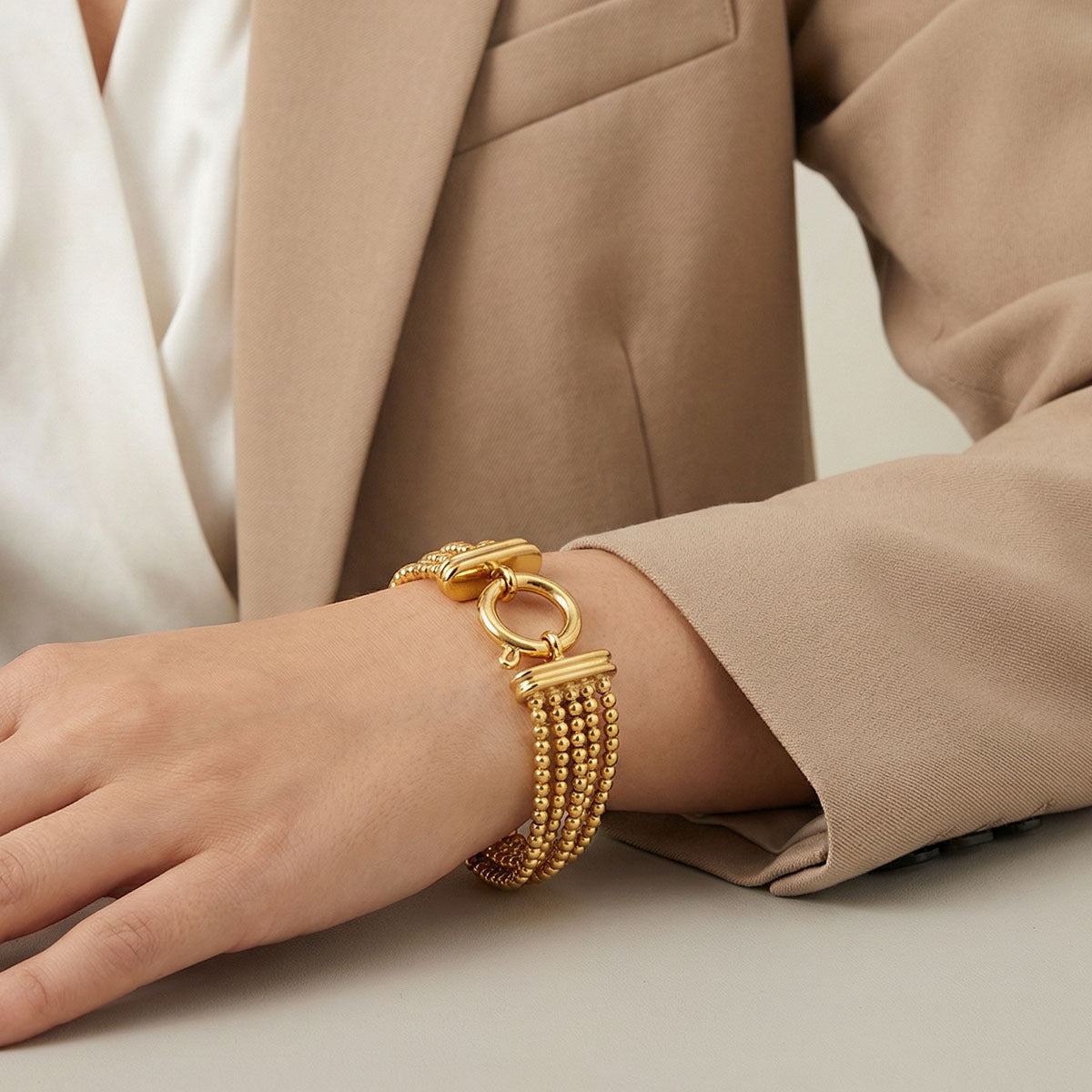 Gold bracelet for women India with multi strand bead pattern 