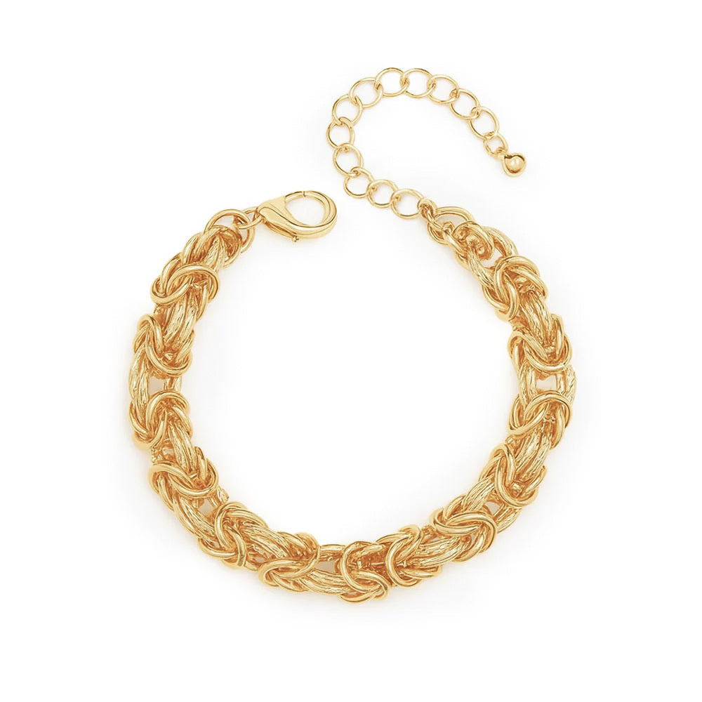 A gold  chain bracelet featuring a textured woven design and an adjustable link clasp for a fit.