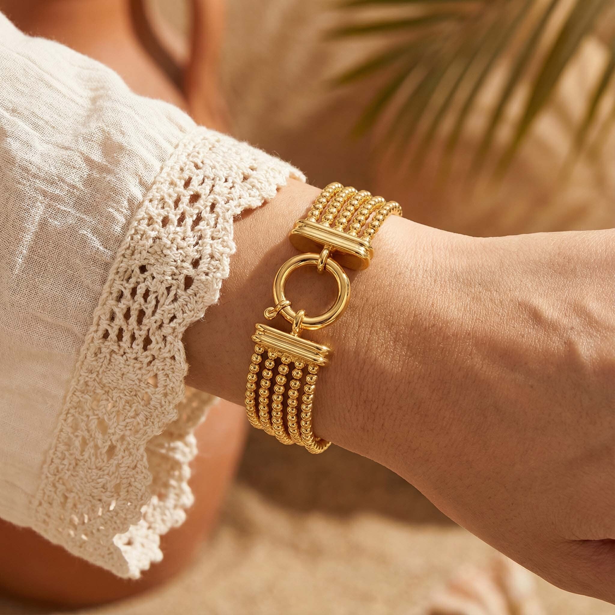 Gold Party Wear  Chain Bracelet for Womenblurred natural background