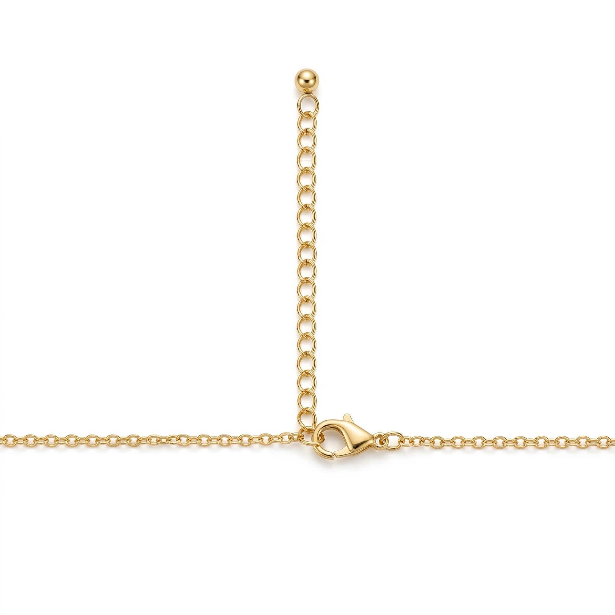 Gold chain necklace on a white background