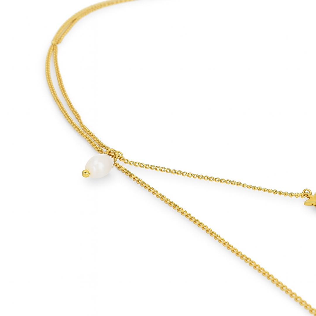 Gold necklace with a single pearl 