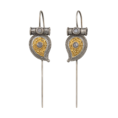 Pair of earrings with gold and silver design on a white background