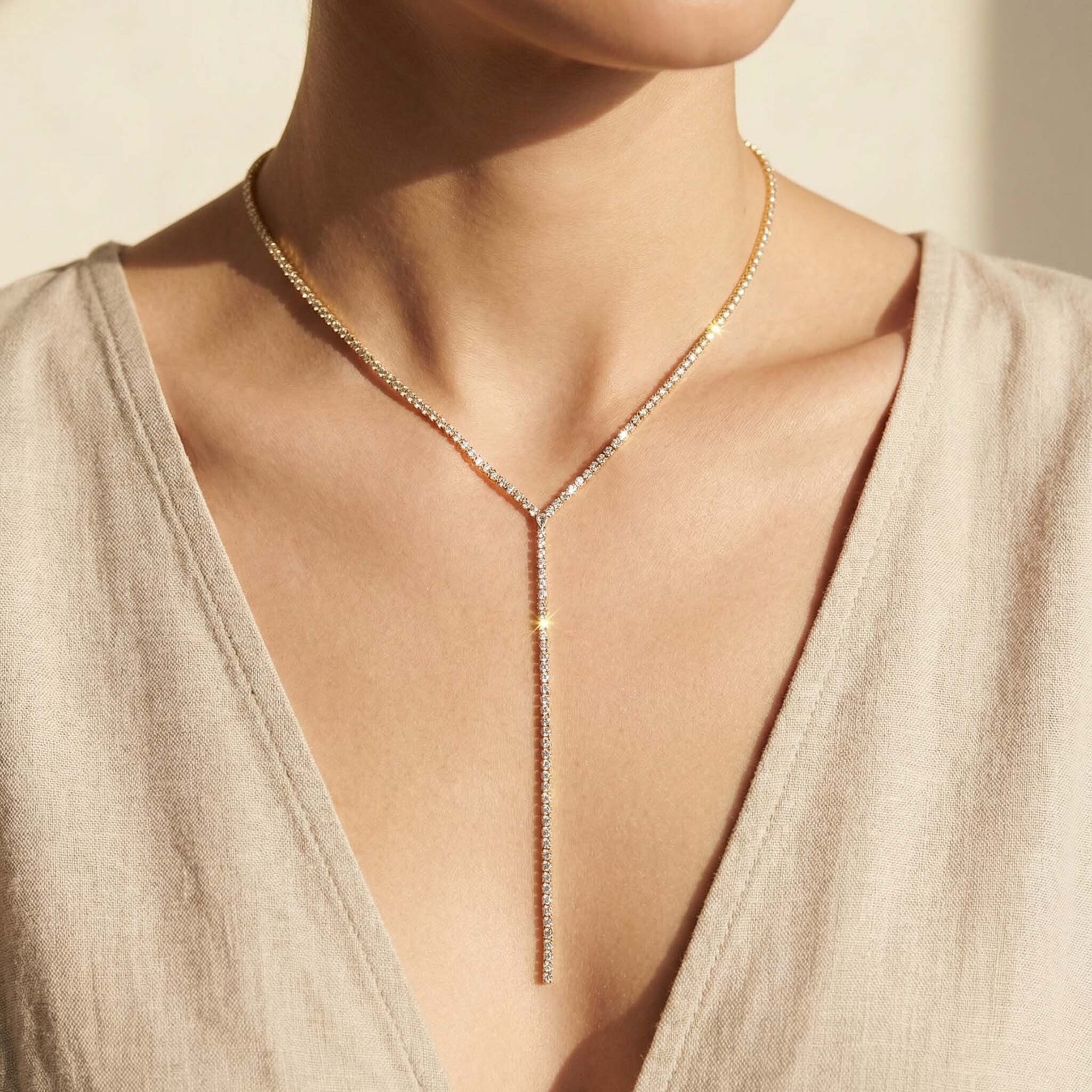 Necklace worn by a person with a neutral background