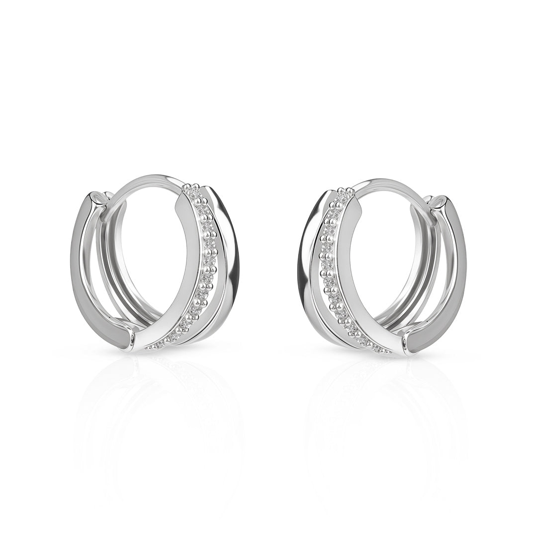 Pair of silver hoop earrings with small diamonds on a white background