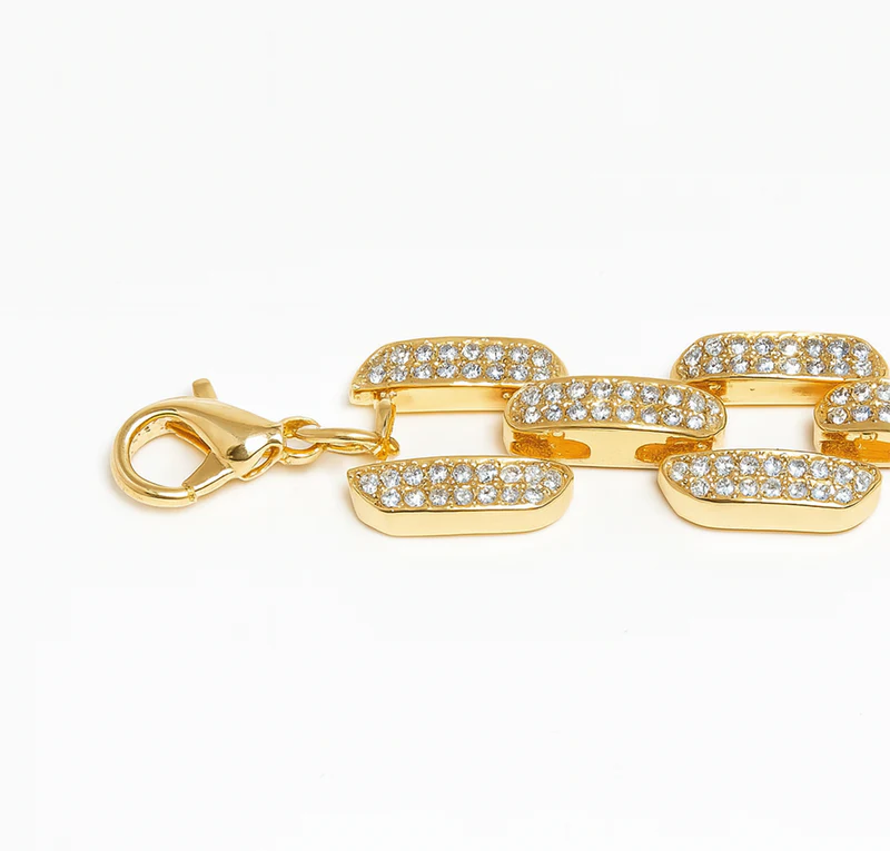 Gold chain necklaces for women with clear gemstones on a white background