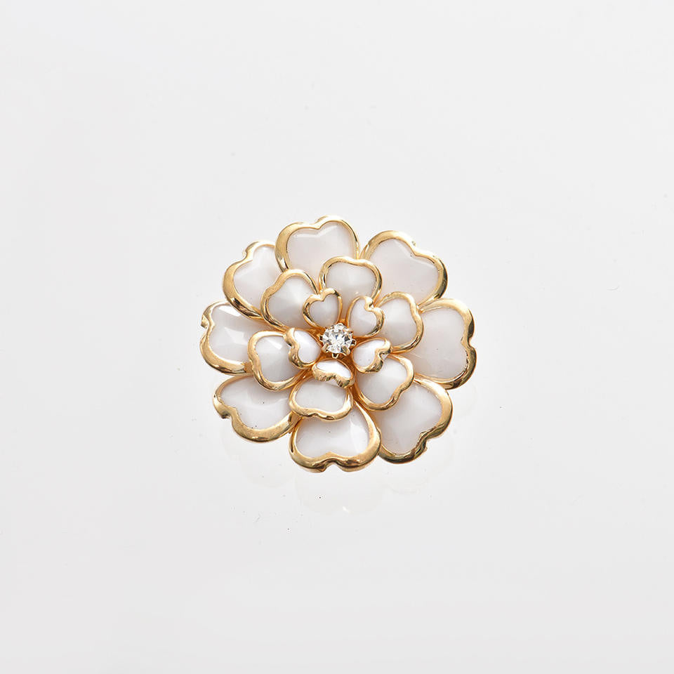 gold floral button with layered petal design and crystal center detail