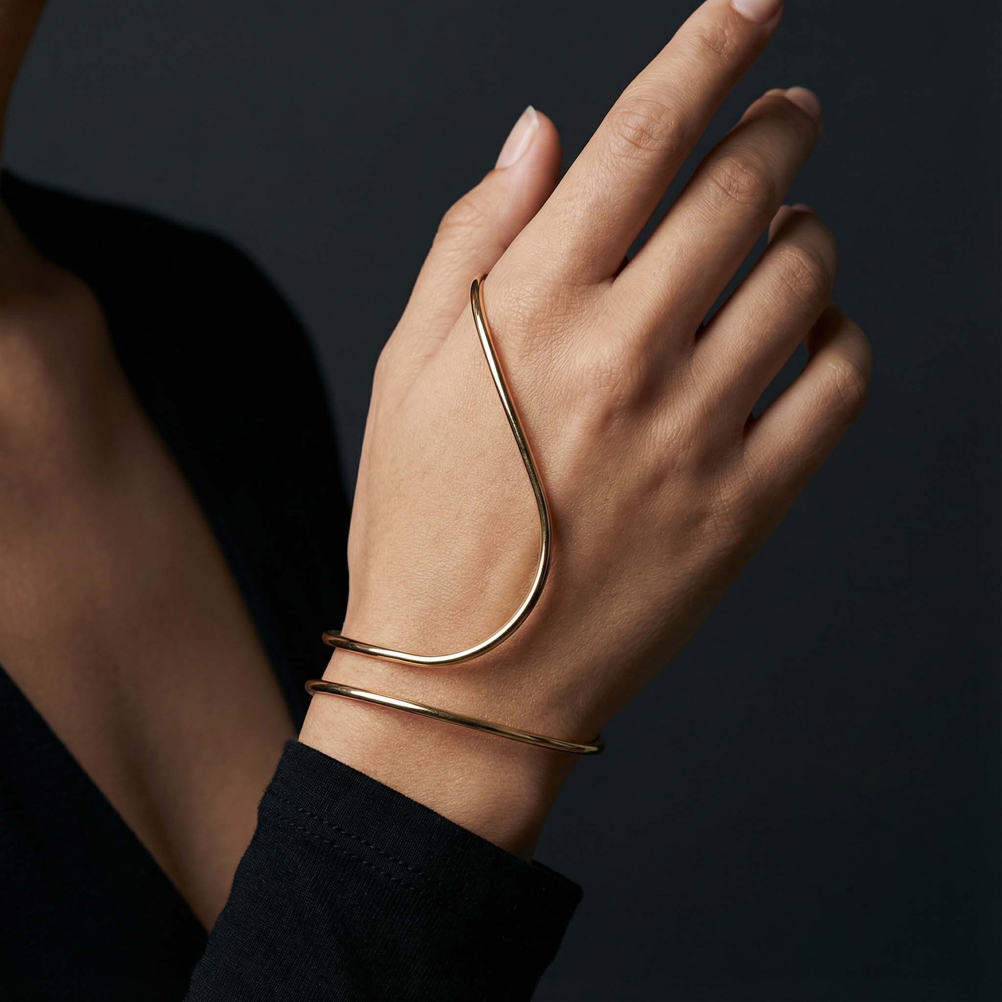 Minimal gold open cuff bracelet for women worn on wrist
