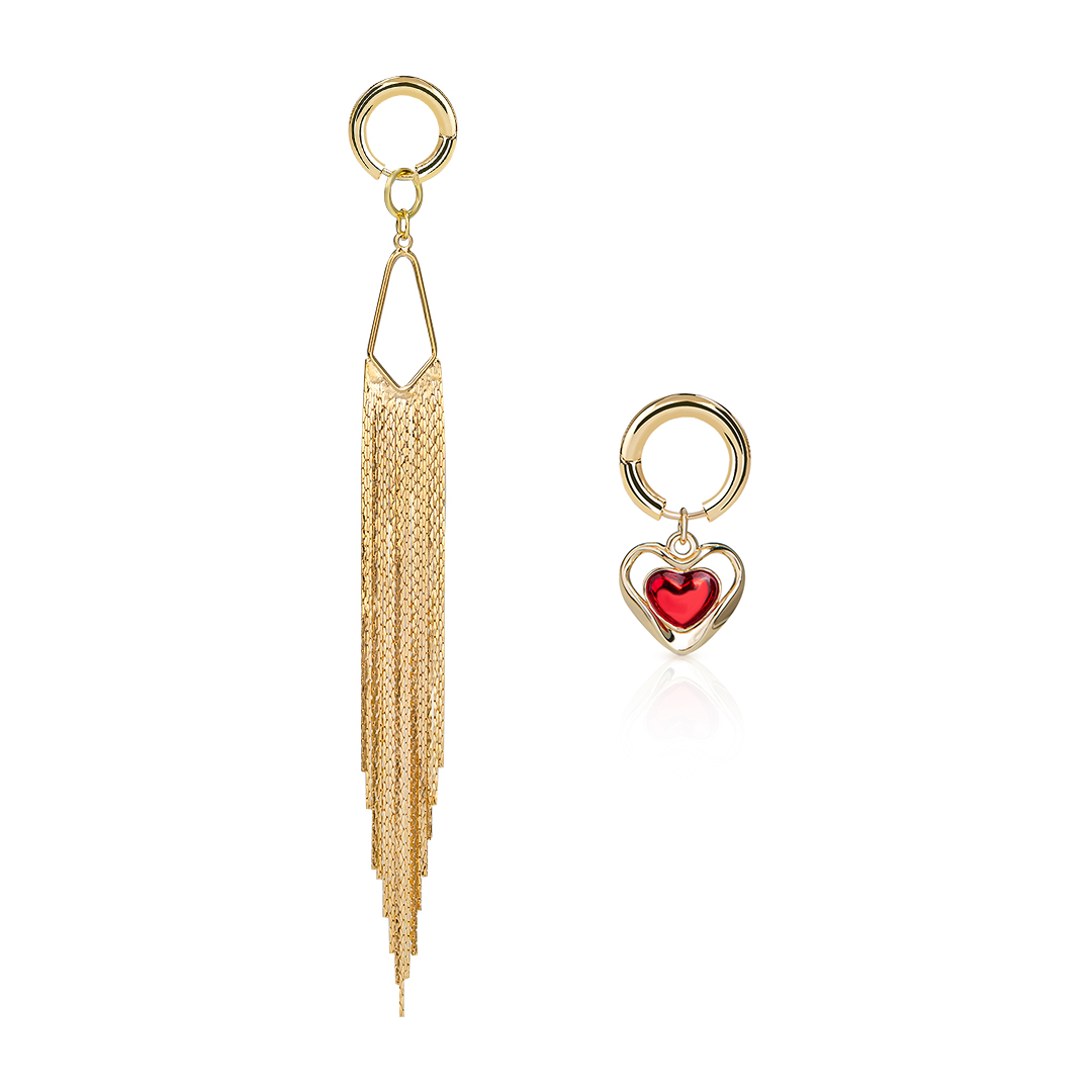Gold tassel earring with red heart charm on a white background