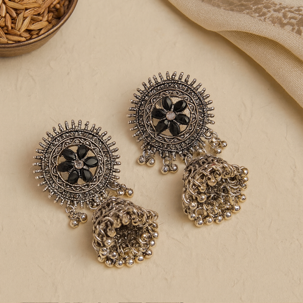 Ornate silver earrings with black 