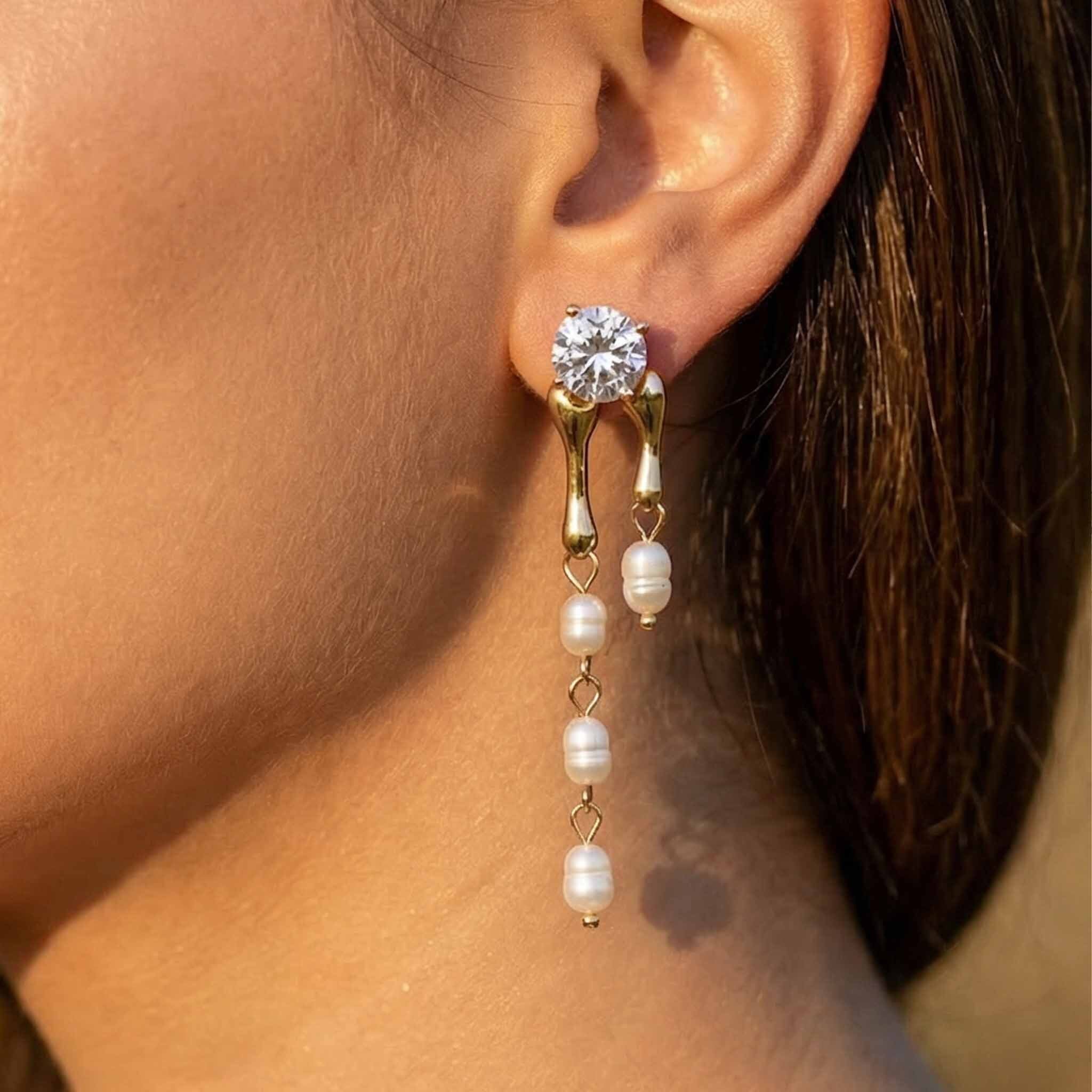 Pearl hanging earrings for women with crystal stud design close-up