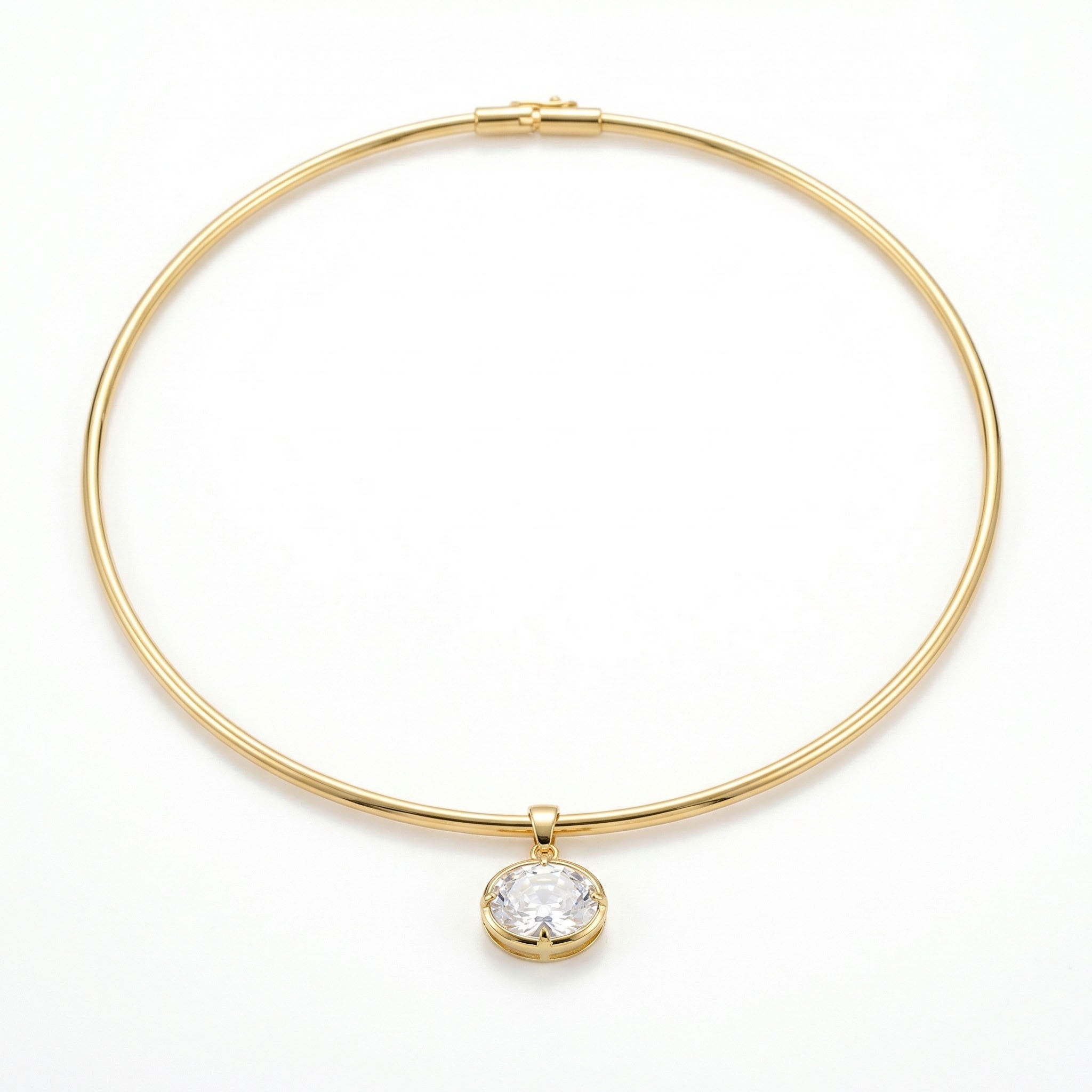 Gold choker necklace with a clear gemstone on a white background