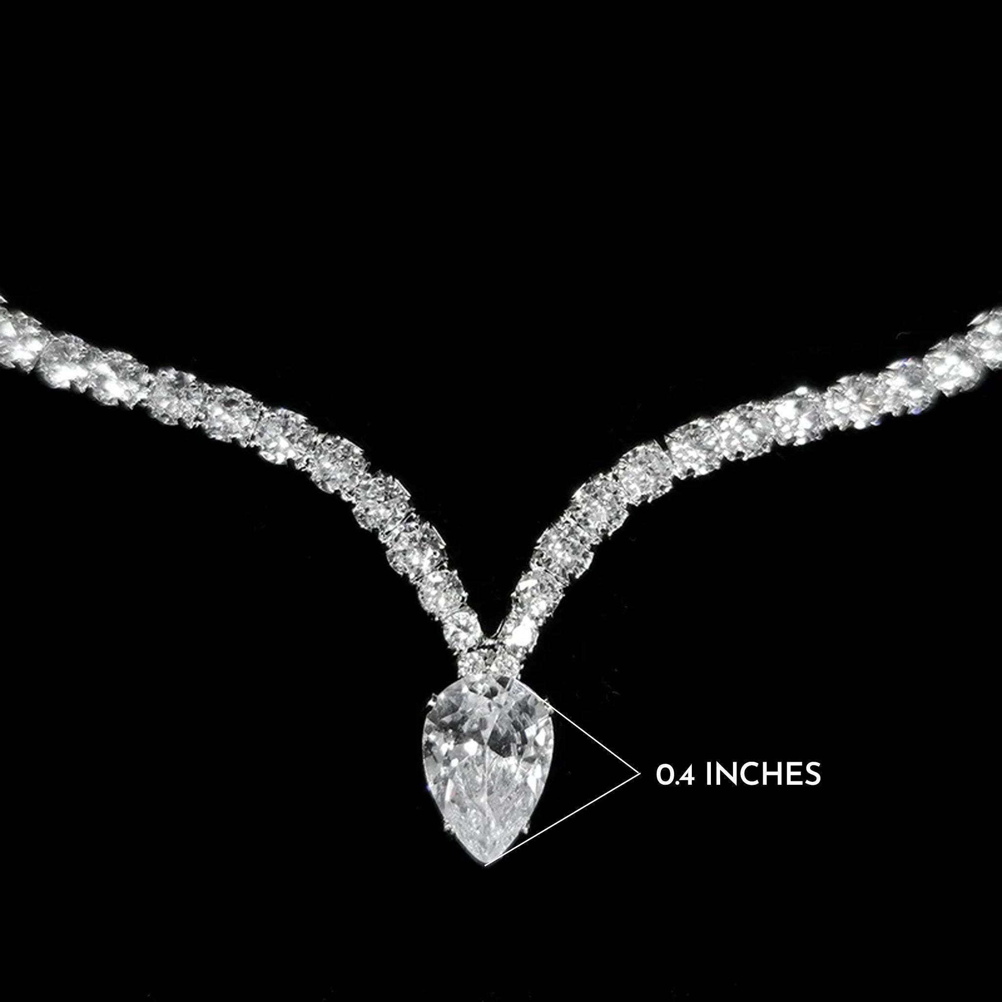 Diamond necklace with a close-up of a pendant labeled '0.4 inches' on a black background